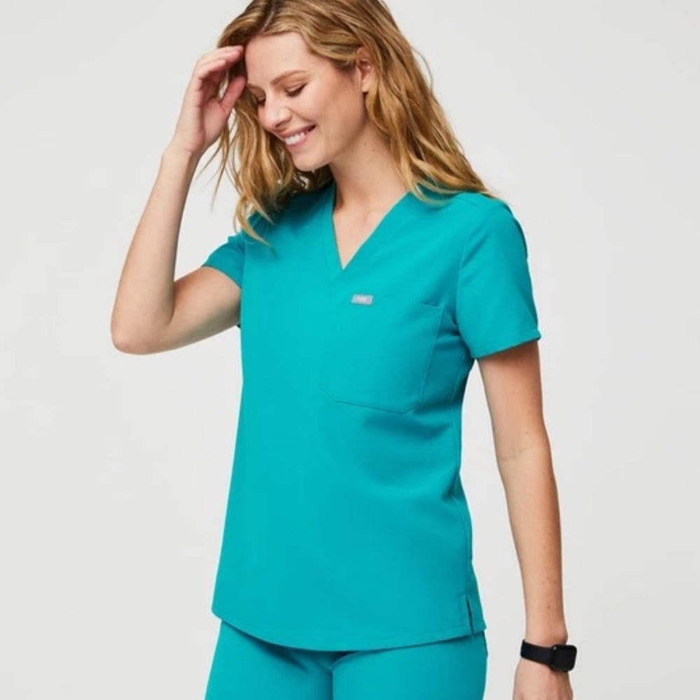 Catarina figs 
2 scrub tops both in size XS
Both scrub tops are in teal.